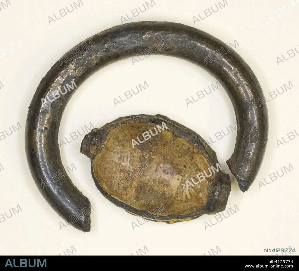 ANCIENT EGYPTIAN. Ring: Cowroid with Sistrum and Pendant Uraeui. Egyptian. Date: 1350 BC. Dimensions: 1.3 × 0.6 × 0.6 cm (1/2 × 1/4 × 1/4 in.). Electrum, steatite. Origin: Egypt.