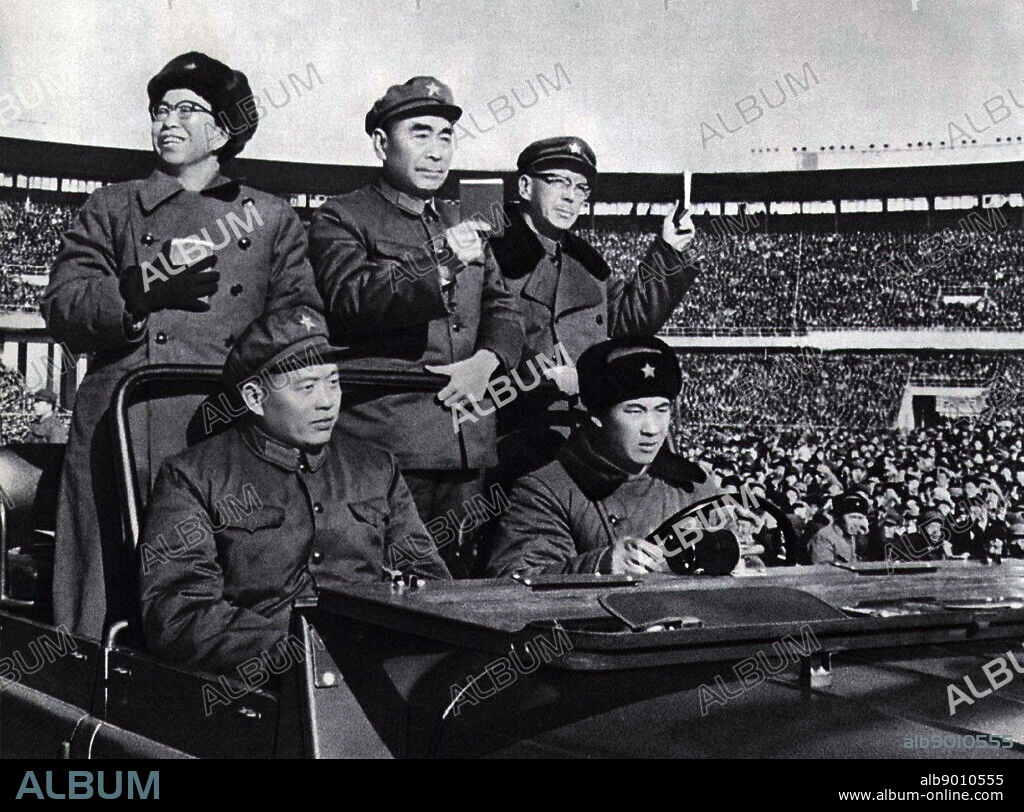 Chinese leaders including Jiang Qing (wife of Mao Zedong) and Prime Minister Zhou Enlai hold the 'little red book' (thoughts of Mao) at a parade in Beijing 1966.
