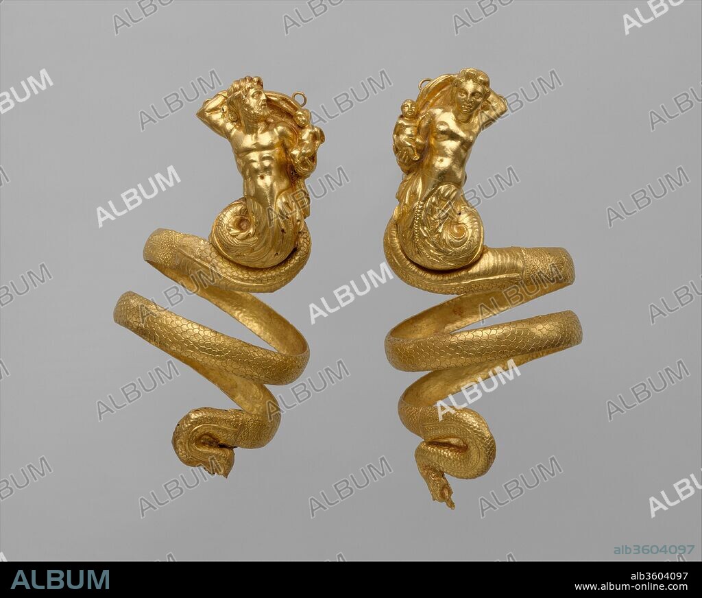 Pair of gold armbands. Culture: Greek. Dimensions: Overall: 10 7/16in., 0.4lb. (26.5cm, 0.2kg)
Other (height-triton armband): 9 13/16in. (25cm)
Other (height-tritoness armband): 10 7/16in. (26.5cm). Date: ca. 200 B.C..
These imposing serpentine armbands represent two tritons, male and female, each holding a small winged Eros. The hoops behind the tritons' heads were used to attach the armbands to the sleeves of a garment, for otherwise, their weight (each over 6 1/2 ounces) would have caused them to slip down the arms.