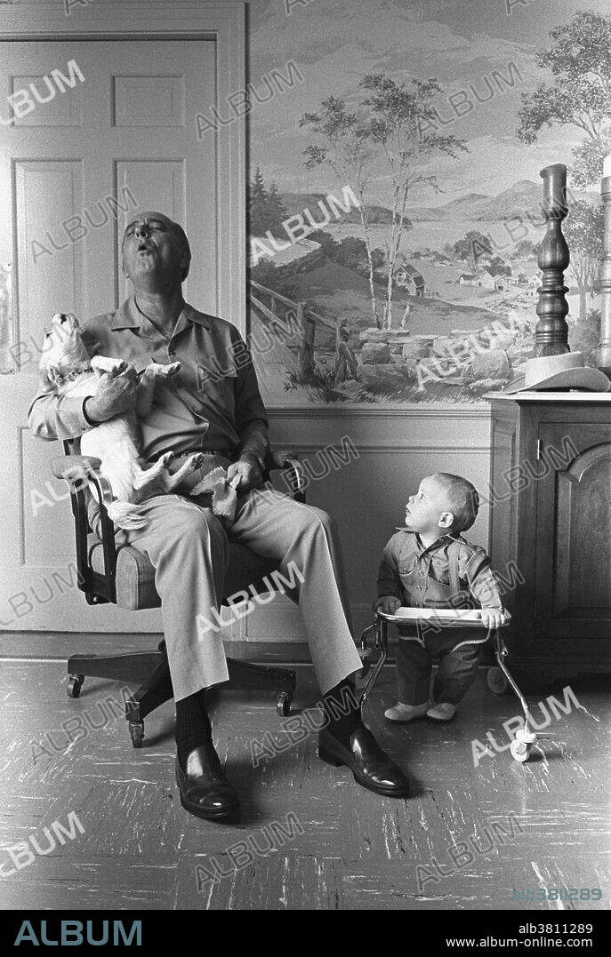 President Johnson sings with Yuki while his grandson, Patrick Lyndon Nugent, looks on. Yuki was a mixed breed dog found by President Johnson's daughter, Luci Nugent, at a gas station in Texas on Thanksgiving Day in 1966, while on her way to the LBJ Ranch. She named the dog, Yuki, which means "snow" in Japanese. At first, Yuki lived with Luci, but while visiting the White House, Yuki won the President's heart and became his faithful companion. On the President's birthday, August 27, 1967, Luci told her father that he could keep Yuki. When President Johnson left office on January 20, 1969, Yuki returned to LBJ Ranch with the President on Air Force One. After Johnson's death in January 1973, Yuki went to live with Luci Johnson Nugent and her family. Yuki died in 1979. Dated January 6, 1968.