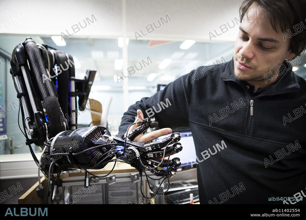 Reportage at ISIR (Institute of Robotics and Intelligent Systems) in Paris, France. HANDLE project : through multidisciplinary research the project aims to understand how humans manipulate objects in order to reproduce gripping movements with an anthropomorphous artificial hand. The aim is to give the robotic hand all the necessary intelligence to define an adapted strategy to manipulate and use any given object as it wishes.