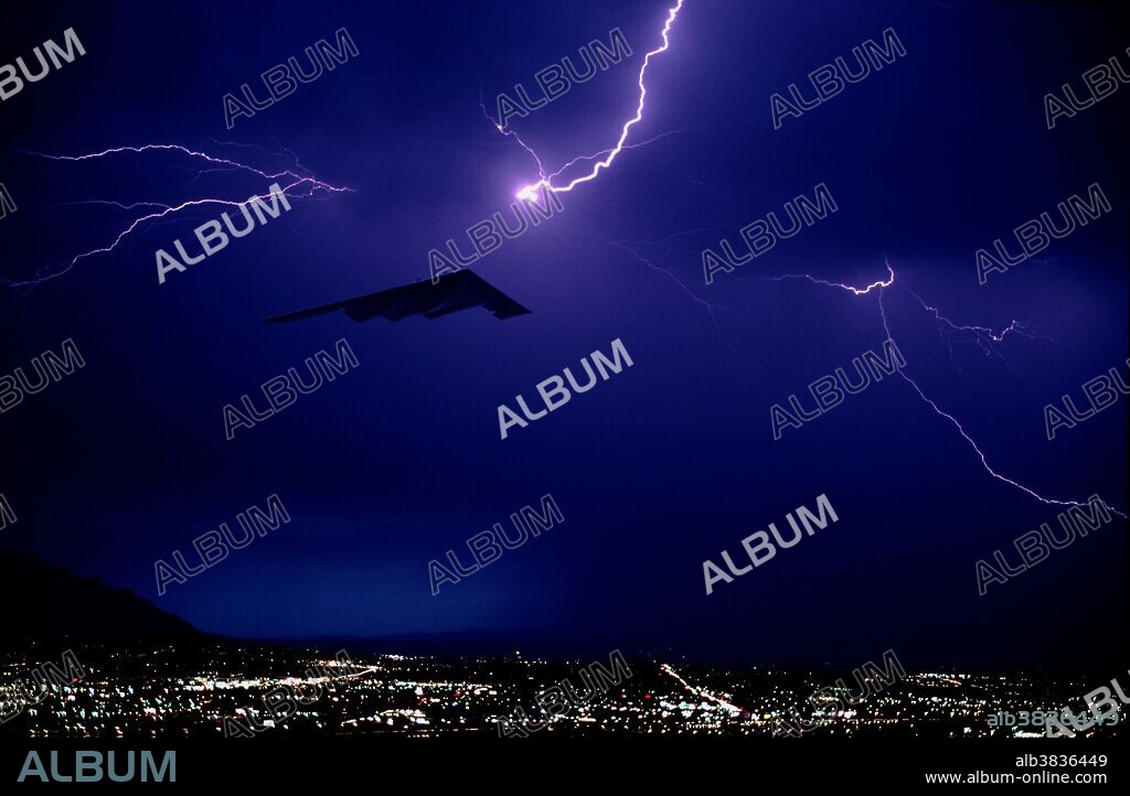 Photoillustration of a B-2 Stealth night flying through a lightning storm. Image has been digitally altered.