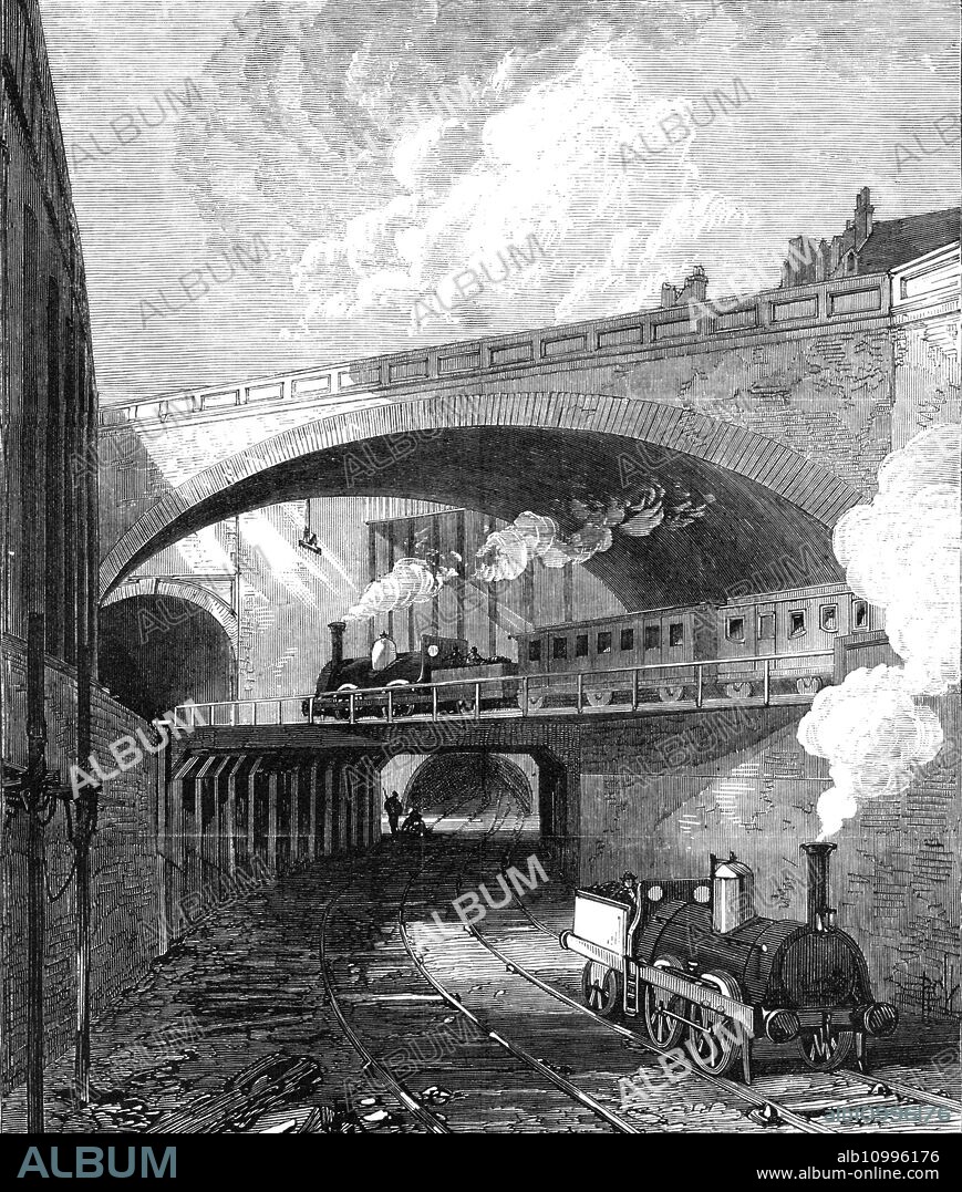 New works on the Metropolitan Railway: entrance to the Clerkenwell Tunnel, 1868. 'This section...is to be used jointly by the Metropolitan, the Great Western, Midland, Great Northern, and London, Chatham, and Dover Companies' trains...the Clerkenwell portion...between Farringdon-road and King's-cross, will become the great central artery for the internal traffic of the whole metropolis, as well as the common link of connection between the great national railways...the Metropolitan Railway Company, with the aid of their chief engineer, Mr. John Fowler...have made extraordinary efforts to prepare for the accommodation, of the greatest number of trains, under so many different managements. One of their principal works during the last twelvemonth has been the widening or doubling of the Clerkenwell section, which has involved the construction of a second tunnel, alongside, the former tunnel, from King's Cross to Ray-street...in addition to diverting the course of sewers and water-mains and the shifting of gas-tubes, the new line necessitated the pulling down and rebuilding of portions of the old or main-line...The new tunnel, commencing at King's Cross, runs parallel with the tunnel of the Metropolitan proper, and, like it, emerges at Ray-street'. From "Illustrated London News", 1868.