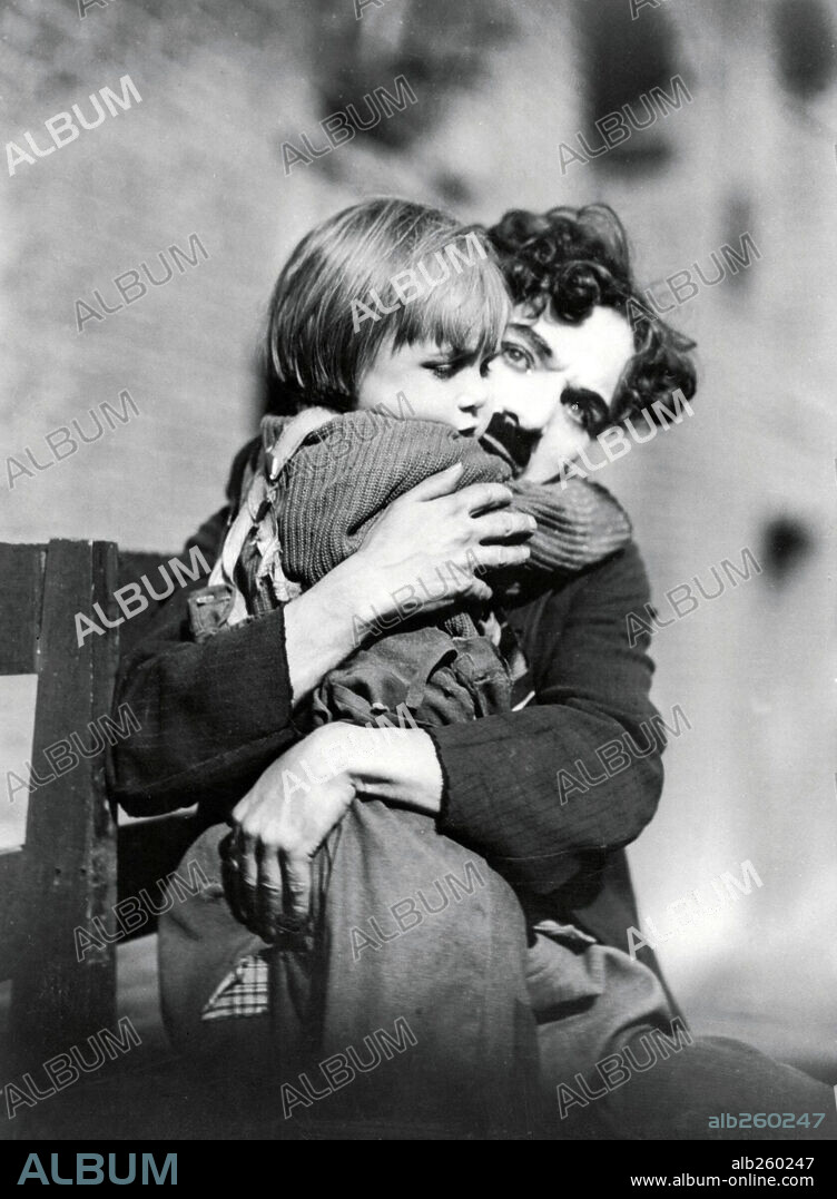 CHARLIE CHAPLIN and JACKIE COOGAN in THE KID, 1921, directed by CHARLES CHAPLIN. Copyright FIRST NATIONAL.