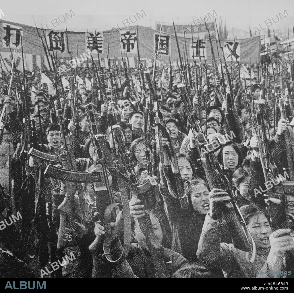 Soldiers of the People's Liberation Army officers study Mao Zedong Quotations.