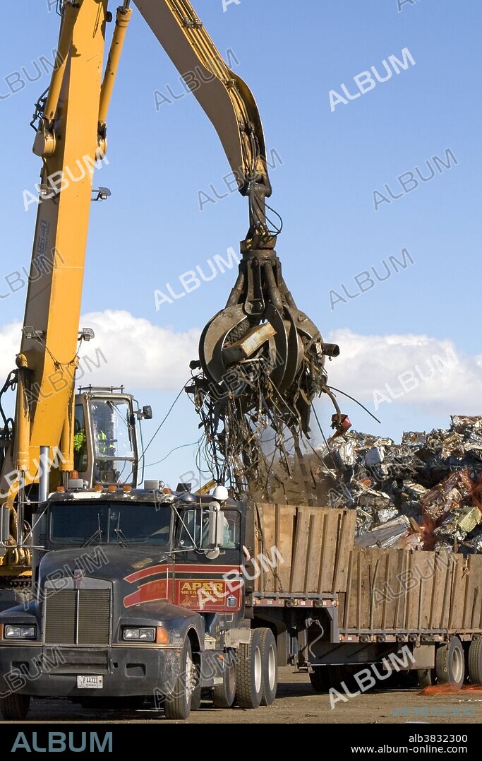 Hydraulic grapple lifting scrap steel for recycling at the Pacific Steel and Recycling center in Elmore County, Idaho.