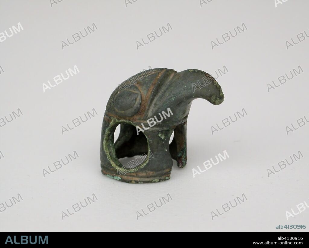 ANCIENT GREEK. Hawk Head. Greek; Thessaly. Date: 650 BC-550 BC. Dimensions: 2.0 x 2.2 x 1.6 cm (3/4 x 7/8 x 5/8 in.). Bronze. Origin: Greece.