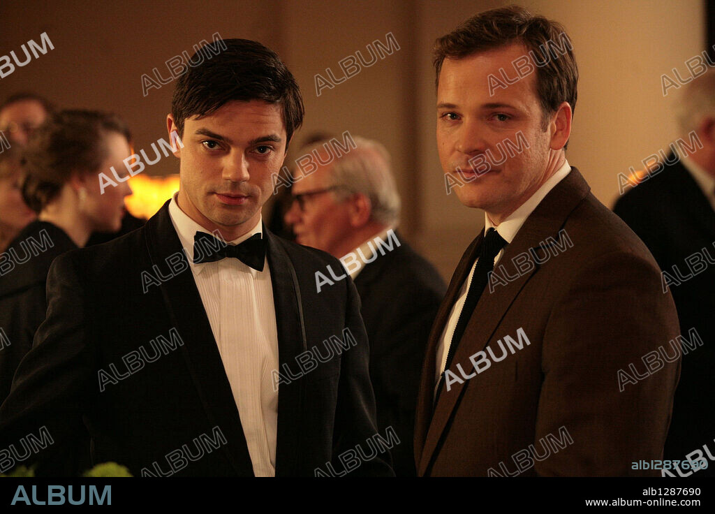 DOMINIC COOPER and PETER SARSGAARD in AN EDUCATION, 2009, directed by LONE SCHERFIG. Copyright BBC FILMS.