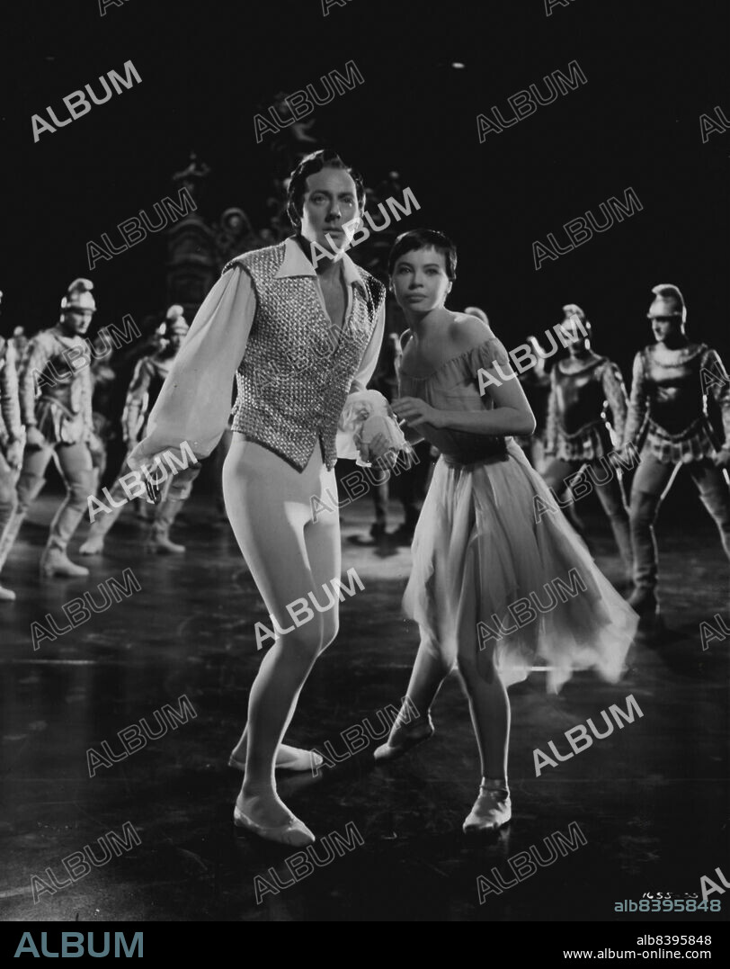 Cinderella And Her Prince...struggle to elude the soldiers of an Egyptian princess, coming between the romance of Leslie Caron and Michael Wilding in this lavish ballet sequence of M-G-M's "The Glass Slipper". In the ballet scenes, in which Miss Caron dreams of her involved romance with Cinderella's prince, the two stars are joined by dancers of Roland Petit's Ballets de Paris. Charles Walters directed and Edwin H. Knopf produced the new film in color, with Keenan Wynn, Estelle Winwood, Barry Jones and Elsa Lanchester also heading the cast. March 12, 1955.