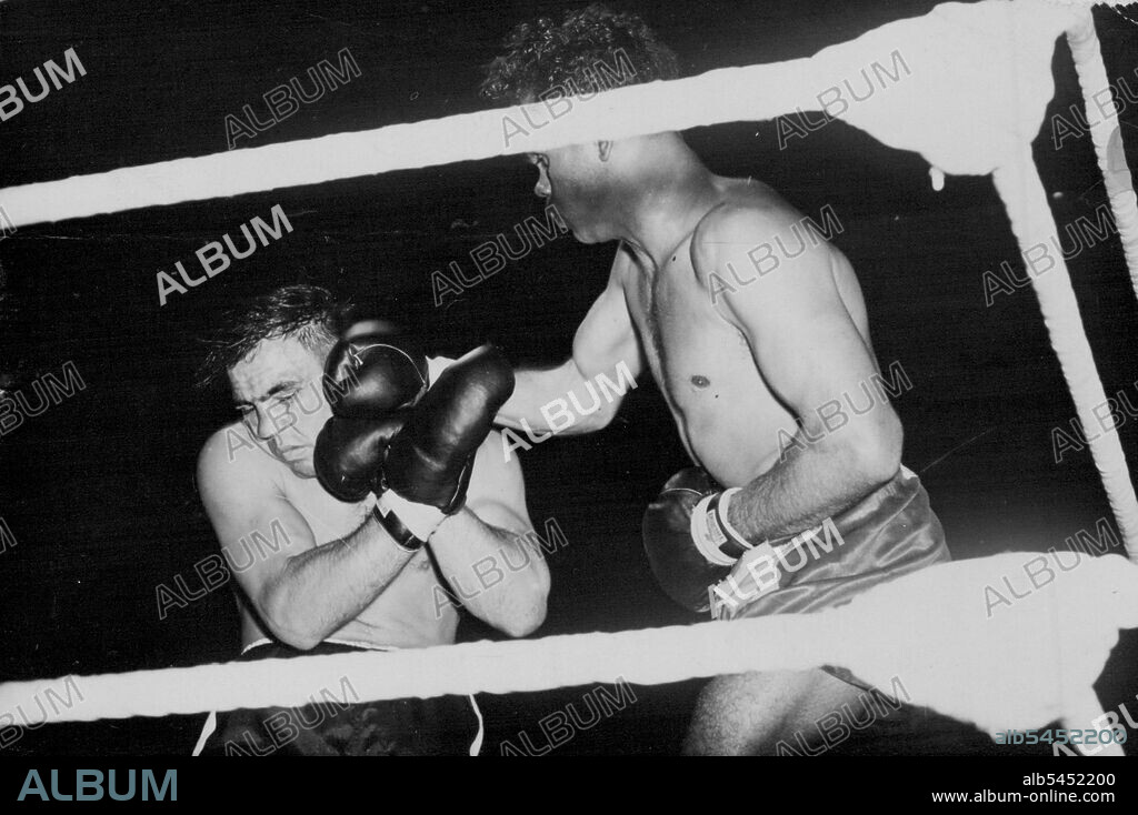 Dave Sands Wins In London -- Sands (right) lands a hard right to Villemain's head.Dave Sands, the Australian triple champion, defeated Robert Villemain, on points in their middleweight contest at Olympia, London, over ten rounds. July 05, 1949. (Photo by Sport & General Press Agency, Limited).