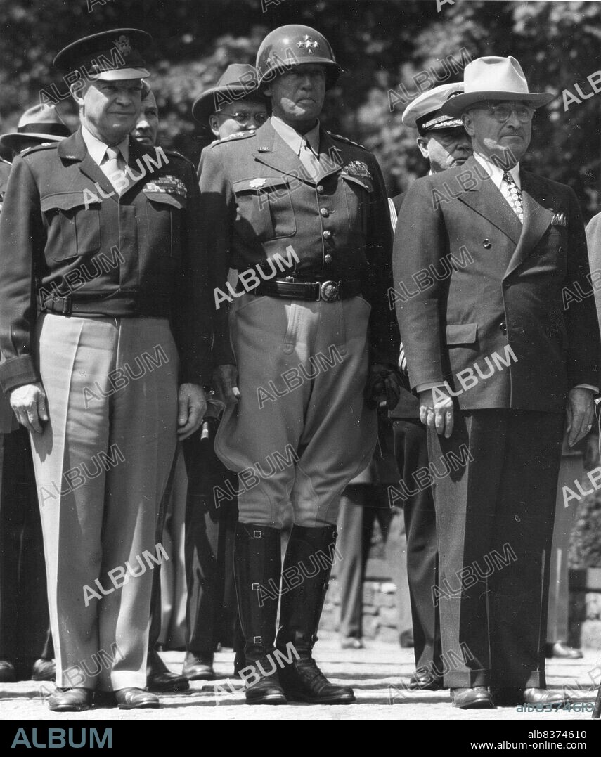 President Harry S. Truman stands with General Dwight D. Eisenhower (left) and General George S. Patton (center) during special flag-raising ceremonies. The President was in Germany attending the Potsdam Conference. Berlin, Germany, 7-28-45.