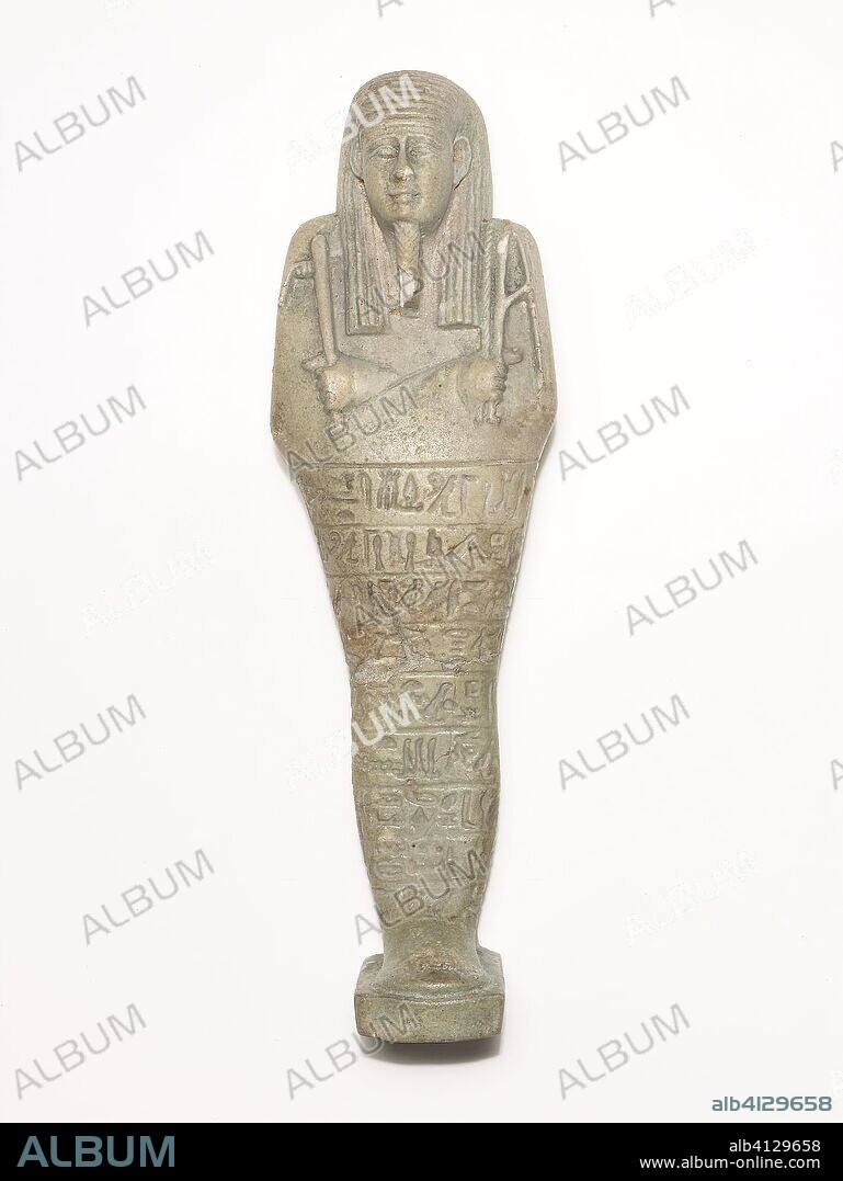 ANCIENT EGYPTIAN. Ushabti (Funerary Figurine) of Horudja. Egyptian; Hawara. Date: 380 BC-343 BC. Dimensions: 21.9 × 6.6 × 4.7 cm (8 5/8 × 2 5/8 × 1 7/8 in.). Faience. Origin: Egypt.