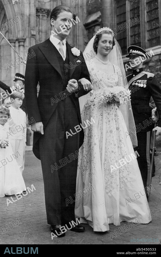 Peer's Daughter Weds In Abbey: Queen Present -- The lovely 18-year-old bride and her bridegroom emerge from Westminster Abbey after the 'wedding of the year.' With the Queen, the Duke of the Edinburgh and other members of the Royal family as guests, the former Miss. Frances Roche, daughter of Lord and Lady Fermoy, was married in the Abbey to Viscount Althorp, 30, only son and heir of the Earl and Countess Spencer. The bride's gown is of camellia while faille embroidered all over with silver sequins, crystals, and hand-cut diamonds. June 1, 1954.