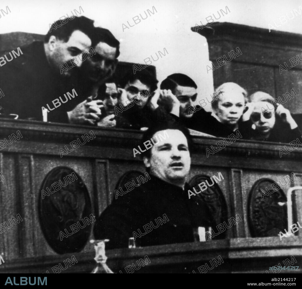 Bolshevik leader sergei mironovich kirov speaking at the 17th congress of the all-union communist party of bolsheviks in february 1934, ordzhonikidze is behind him on the left.