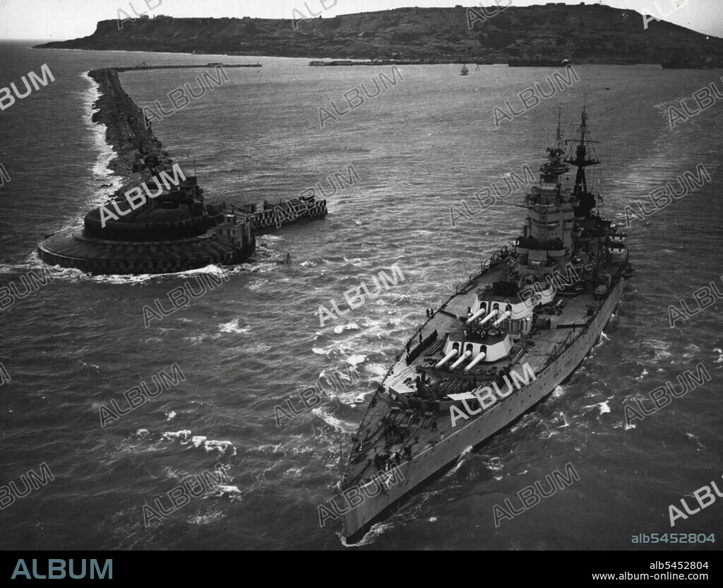H.M.S. Nelson Goes To "War" - In Face -- Leading the first fleet spring Exercises since the end of the war, H.M. battleship Nelson sailed from Portland yesterday morning. In company with the cruisers Birmingham Bellona and Diadem, she will be "attacked" by British submarines and aircraft during ***** six-weed return cruise *****. March 10, 1946. (Photo by Fox Photos).