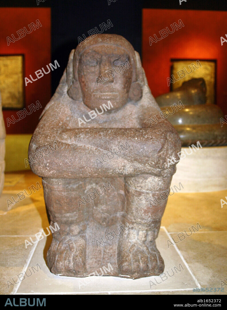 Seated stone figure of Xochipilli the Aztec god of music and dance. Mexico, AD 1325-1521. Macuilxochitl. Pre-Columbian Mesoamerican Religion Mythology Sculpture.