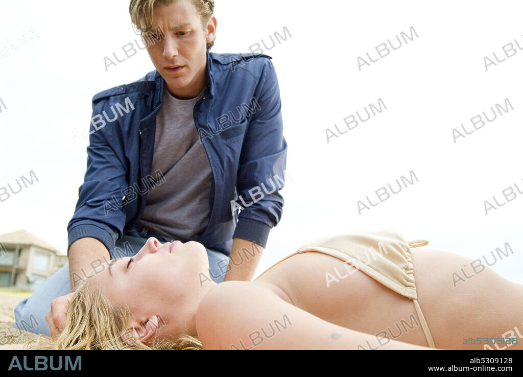 AMBER HEARD and JON FOSTER in THE INFORMERS, 2009, directed by GREGOR JORDAN. Copyright SENATOR ENTERTAINMENT/KULTURE MACHINE.