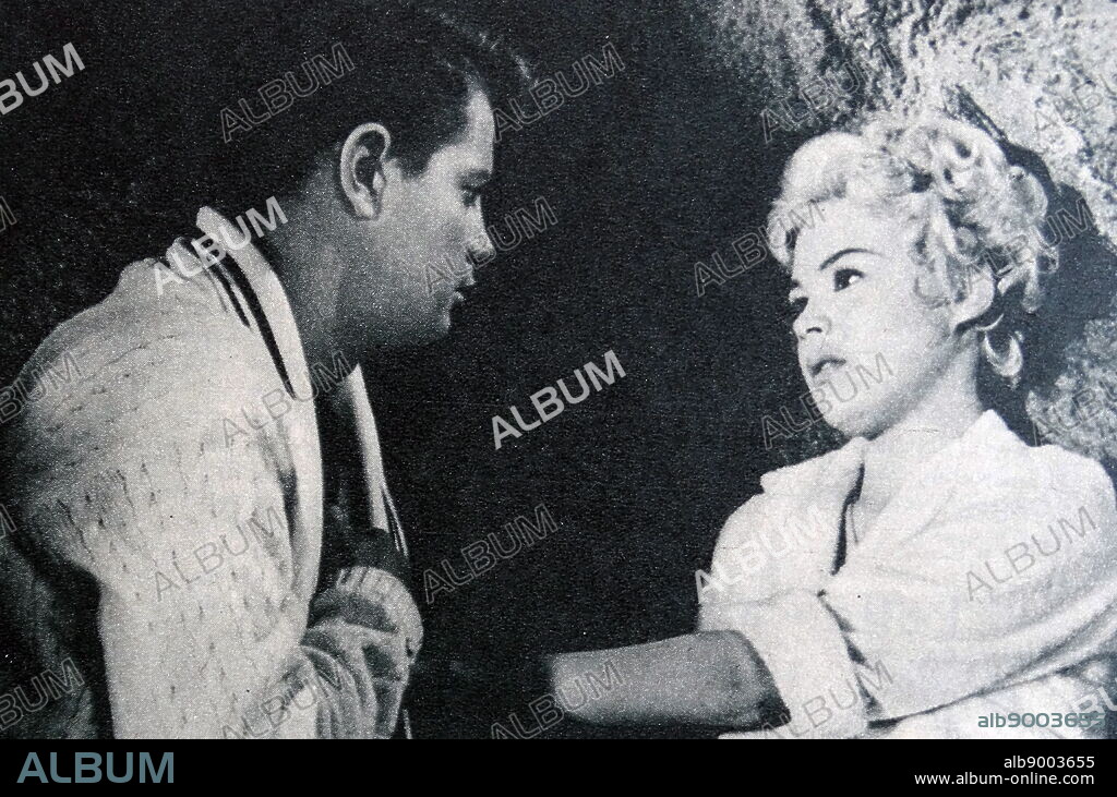Sandra Dee and Troy Donaghue in A Summer Place, a 1959 American romantic drama film based on Sloan Wilson's 1958 novel of the same name. Sandra Dee (born Alexandra Zuck; April 23, 1942 - February 20, 2005) was an American actress. Dee began her career as a child model, working first in commercials, and then film in her teenage years. Troy Donahue (born Merle Johnson Jr., January 27, 1936 - September 2, 2001) was an American film and television actor and singer. He was a popular sex symbol in the 1950s and 1960s.