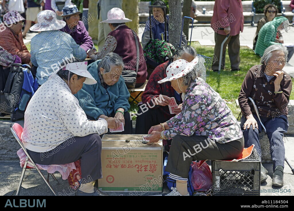 People playing Chinese chess at Portsmouth Square in Chinatown, San Francisco, California, United States of America, North America.