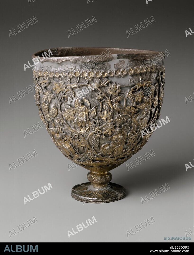 The Antioch "Chalice". Culture: Byzantine. Dimensions: Overall: 7 11/16 x 7 1/16 x 6 in. (19.6 x 18 x 15.2 cm)
foot: 2 15/16 in. (7.4 cm). Date: 500-550.
When it was discovered at the beginning of the twentieth century, this "chalice" was claimed to have been found in Antioch, a city so important to the early Christians that it was recognized with Rome and Alexandria as one of the great sees of the church. The chalice's plain silver interior bowl was then ambitiously identified as the Holy Grail, the cup used by Christ at the Last Supper. The elaborate footed shell enclosing it was thought to have been made within a century after the death of Christ to encase and honor the Grail. The fruited grapevine forming the rinceau pattern of the gilded shell is inhabited by birds, including an eagle; animals, including a lamb and a rabbit; and twelve human figures holding scrolls and seated in high-backed chairs. Two of the figures are thought to be images of Christ. The other ten figures have been variously identified as ten of the twelve apostles, or philosophers of the classical age, who, like the prophets of the Old Testament, had foretold the coming of Christ. The sixth-century chronicler Malalas of Antioch was among those who sought to make such links between Christianity and classical philosophy.
The identification of the "Antioch Chalice" as the Holy Grail has not been sustained, and even its authenticity has at times been challenged. The work has usually been considered a sixth-century chalice for the Eucharist. Most recently, however, its shape has been recognized as more closely resembling sixth-century standing lamps, its decoration possibly in recognition of Christ's words "I am the light of the world" (John 8:12). It has been argued to be part of a treasure of liturgical objects found in 1908 belonging to the Church of Saint Sergios in the town of Kaper Koraon southeast of Antioch. If so, Saint Sergios' parishioners might well have traveled to Antioch to purchase the object as a donation for their church. Or it may have been used in one of the churches in or near Antioch.
