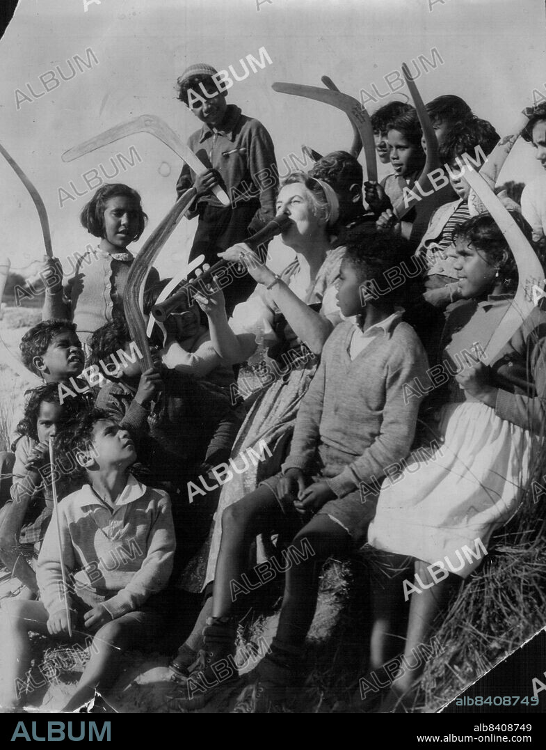 Trapp Family Singers.This shot taken at La Perouse showing the Baroness Maria Augusta von Trapp playing her recorder to some of the happy little Abo children. After they had shown her how to throw a boomerang.Taken on the La Perouse Beach.. The Baroness is the mother of the famous Trapp family singers.. They start their first concerts at the con on Thurs night.August 17, 1955. (Photo by Gordon Herbert Short/Fairfax Media).