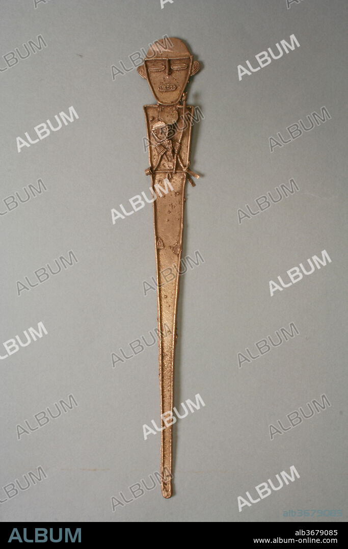 Female Figure (tunjo). Culture: Muisca. Dimensions: H. 7 3/4  x W. 1 1/8  x D. 1/8 in. (19.7 x 2.8 x 0.3cm). Date: 10th-16th century.
Muisca votive objects, called <i>tunjos</i>, were made in a variety of forms: animate, that is, human figures and animals, and inanimate-weapons, lime containers, and snuff tablets. Human images, always differentiated by sex, are the most common type of <i>tunjo</i>. Most are simple, flat plaques with a great deal of specific detail added onto the surface, as thin gold threads. The figures depict actual Muisca people and activities, for instance, mothers holding children, as on this example. Male figures carry weapons or chew coca. Quality of workmanship and realistic proportions were of less concern to <i>tunjo</i> makers than subject matter.
This <i>tunjo</i> depicts a female figure holding a smaller one, possibly a child, in one hand and a baton on the other. A long, multistrand necklace is on her chest and a prominent disk-shaped pectoral under her chin. Her small feet, worked as a series of fine gold threads, appear in the upper half of the tall plaque.
<i>Tunjos</i> were buried in groups or thrown into lakes. They occur only rarely in tombs.