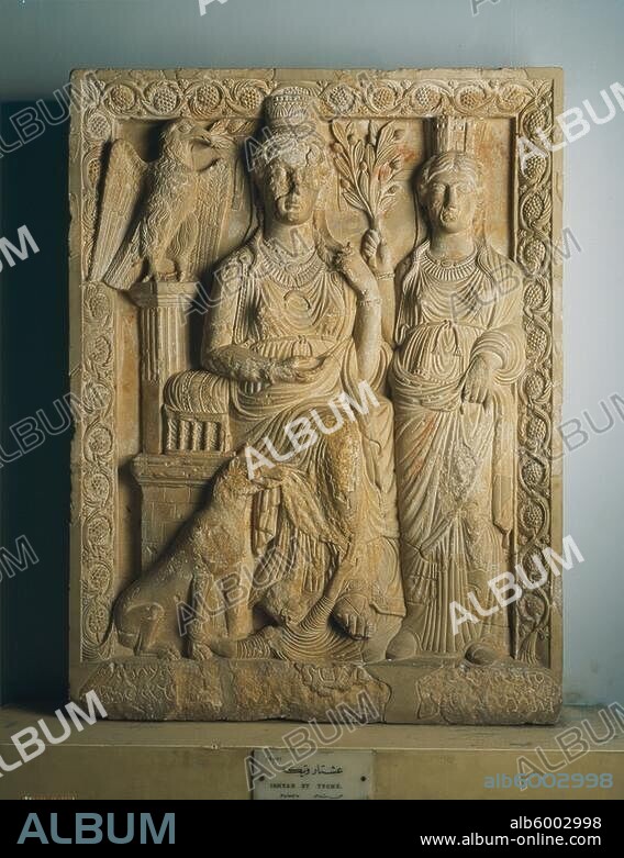 Palmyranian, 1st half of 1st c. A.D.-The "good goddess" (Herta?), enthroned between the eagle of Bel and the Tyche, a dog lying before her, a defeated foe at her feet.-/ Limestone, height: 90 cm, width: 68 cm, depth: 12 cm. Origin: Palmyra. Inv. No. B 16441.