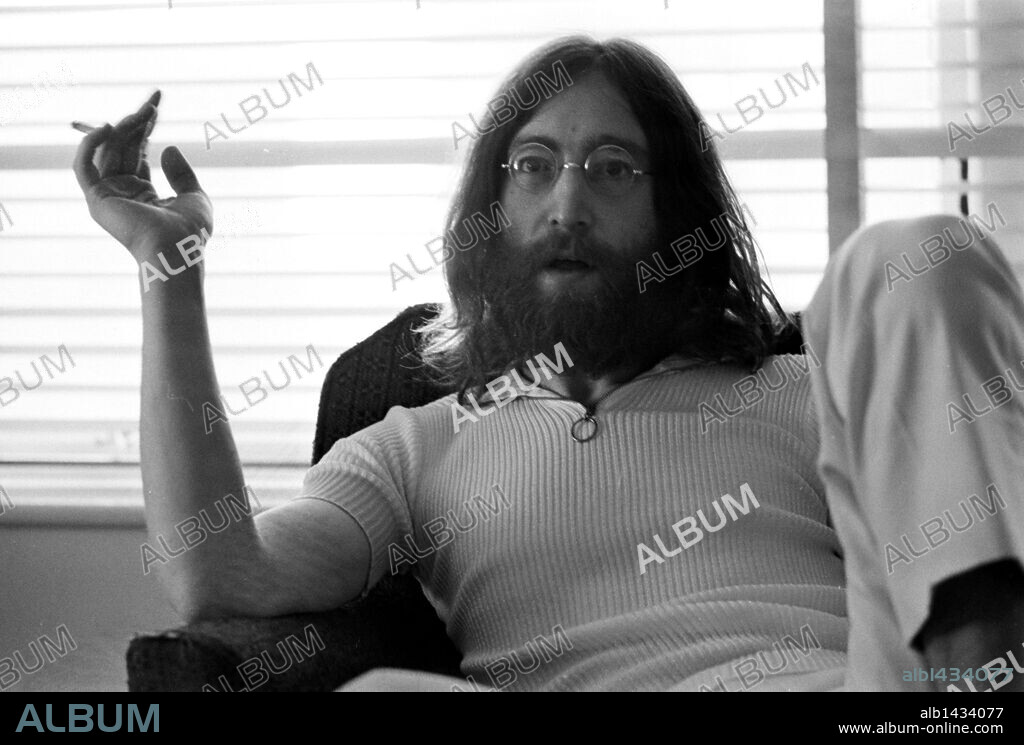 John Winston Ono Lennon, MBE, born October 9, 1940, murdered December 8, 1980, was an English songwriter, singer, musician, graphic artist, author and peace activist who gained worldwide fame as one of the founders of The Beatles.  PICTURED: May 26, 1969 - Toronto, Ontario, Canada -Singer, activist and writer JOHN LENNON smokes a cigarette while relaxing in his hotel. The Beatles had just broke up and recently announced the end. 08/12/2005