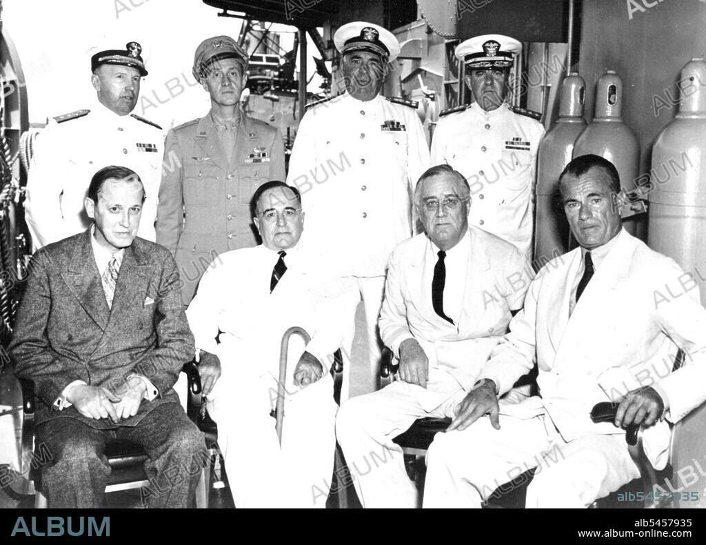President Roosevelt And President Vargas Confer -- Following a conference aboard a United States destroyer in the Potengi River Harbor at Natal, Brazil, President Franklin D. Roosevelt and President Getulio Vargas of Brazil are photographed on deck. Seated, lift to right. Harry Hopkins, adviser to President Roosevelt, President Vargas, President Roosevelt and Jefferson Caffery, U.S. Ambassador to Brazil. September 28, 1943.