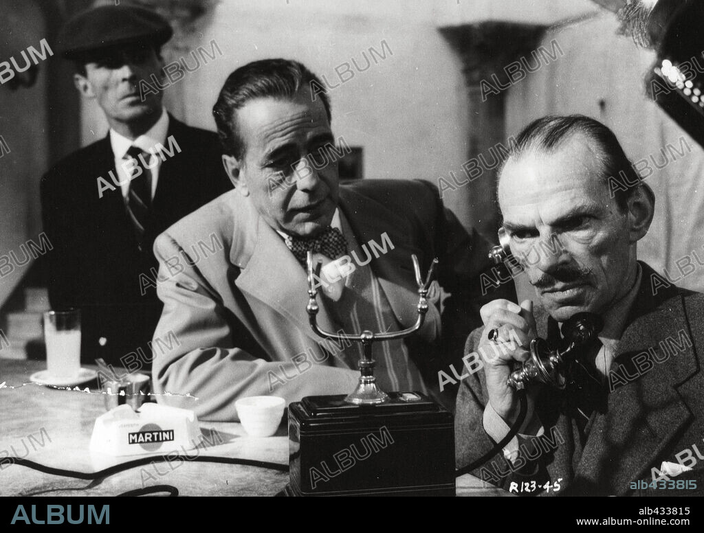 EDWARD UNDERDOWN, HUMPHREY BOGART and IVOR BARNARD in BEAT THE DEVIL, 1953, directed by JOHN HUSTON. Copyright UNITED ARTISTS.