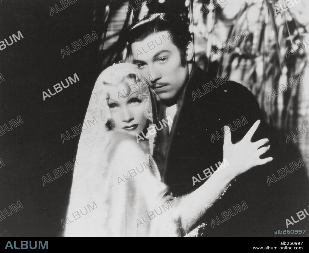 CESAR ROMERO and MARLENE DIETRICH in THE DEVIL IS A WOMAN, 1935, directed by JOSEF VON STERNBERG. Copyright PARAMOUNT PICTURES.