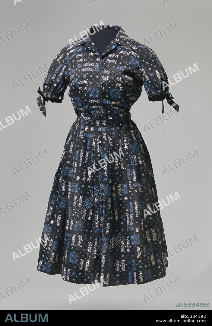 Carlotta Walls LaNier was the youngest of the nine African-American students to desegregate Little Rock Central High School in September, 1957. She wore this matching skirt and blouse to the first day of school, which was also the first day she was turned away. The outfit consists of a skirt and blouse in a matching alphabetical print of blue, teal, and white on a black background. The blouse fastens with small black buttons, has a pointed collar and short sleeves that tie into bows at the cuffs. The skirt is full and has several pleats at the waist.