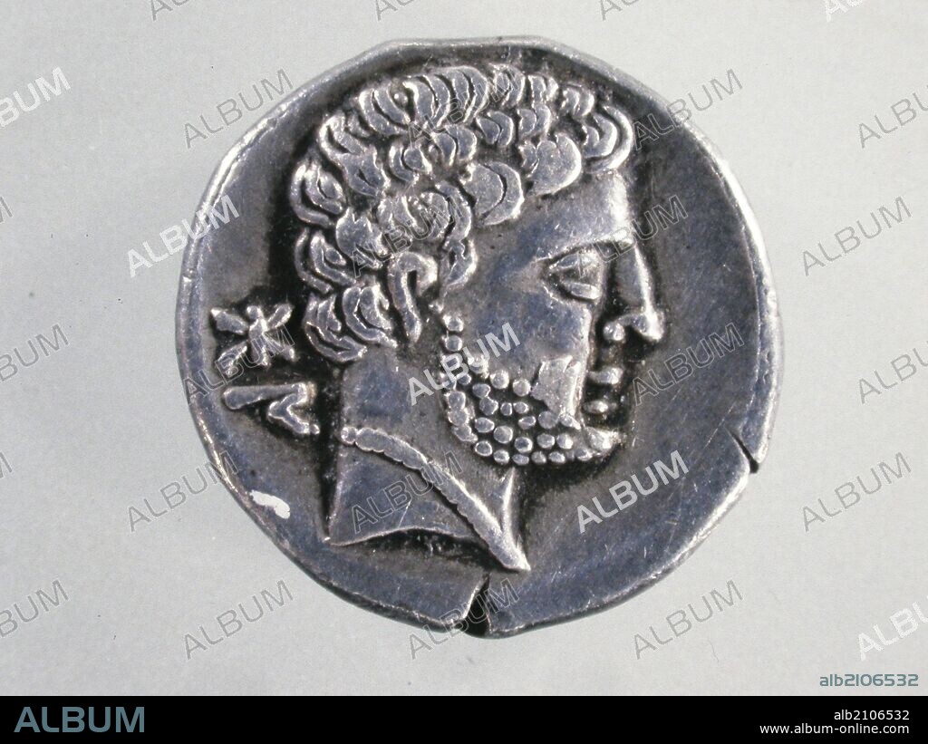 NUMISMATICA. MONEDA BERICA. DENARIO IBERICO DE BOLSCAN. ANVERSO. PERFIL DE HOMBRE CON MELENA RIZADA, BARBA Y COLLAR. INSCRIPCION AL LADO IZQUIERDO DEL PERFIL. (DEPOSITO: MUSEO ARQUEOLOGICO NACIONAL).