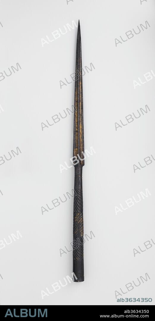 Lance Head. Culture: Syrian or Egyptian. Dimensions: H. 26 3/8 in. (67 cm); Wt. 1 lb. 10.2 oz. (742.8 g). Date: ca. 1500.
The skillfully chiseled fluting patterns on the socket of this lance head are characteristic of Mamluk iron work and can be seen on Mamluk ax and mace shafts, and other lance heads. The long lance was one of the prime weapons of Mamluk cavalrymen.
