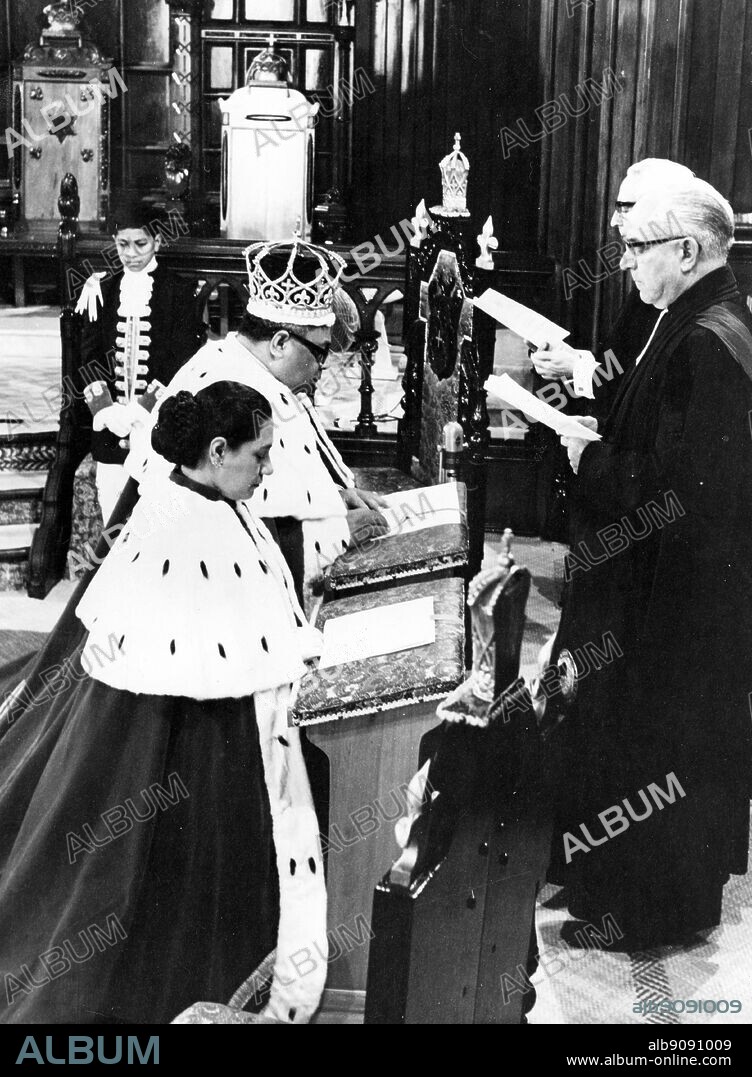 1967: King of Tonga's coronation. The prayer being said shortly after the Crown had been placed on the King's head. King Taufa-ahau Tupou IV and his queen.