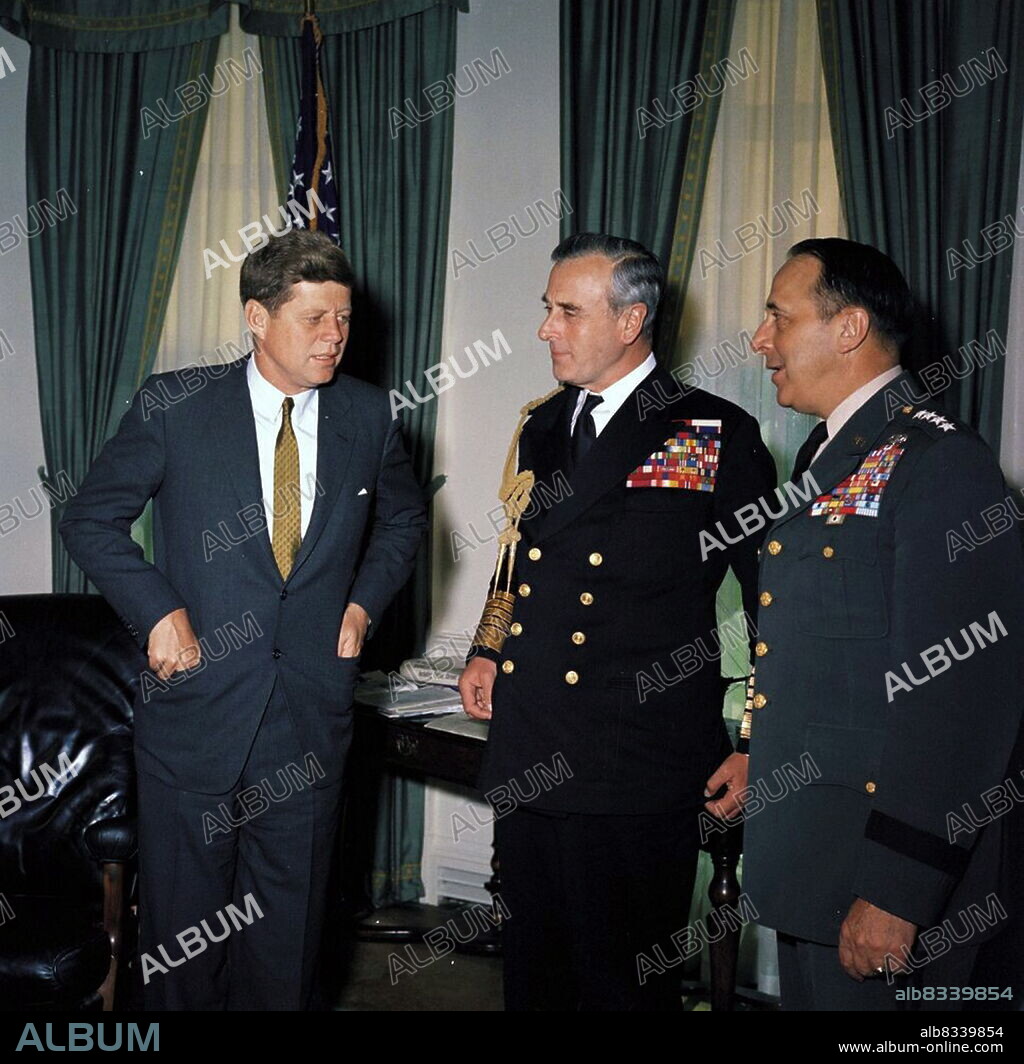 President John F. Kennedy meets with Chief of the Defense Staff of the British Armed Forces Lord Louis Mountbatten, First Earl Mountbatten of Burma (centre) and Chairman of the Joint Chiefs of Staff General Lyman Lemnitzer (right) in the Oval Office, White House, Washington, D.C. 1961.