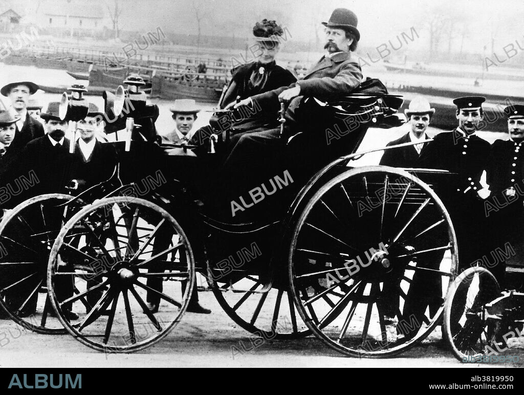 Bertha Benz with her husband Karl in a Benz Viktoria, model 1894. Karl Friedrich Benz (November 25, 1844 - April 4, 1929) was a German engine designer and engineer, generally regarded as the inventor of the first automobile powered by an internal combustion engine, and together with Bertha Benz, pioneering founder of the automobile manufacturer Mercedes-Benz. Other German contemporaries, Gottlieb Daimler and Wilhelm Maybach working as partners, also worked on similar types of inventions, without knowledge of the work of the other, but Benz received a patent for his work first, and, subsequently patented all the processes that made the internal combustion engine feasible for use in an automobile. In 1879, his first engine patent was granted to him, and in 1886, Benz was granted a patent for his first automobile. In 1926, Benz & Cie. and DMG merged as the Daimler-Benz company. A new logo was created, consisting of a three pointed star (representing Daimler's motto: "engines for land, air, and water") surrounded by traditional laurels from the Benz logo, and the brand of all of its automobiles was labeled Mercedes Benz. Benz was a member of the new Daimler Benz board of management for the remainder of his life. He died in 1929 at the age of 84 from a bronchial inflammation. No photographer credited, undated.