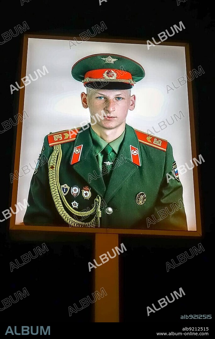 Illuminated photograph of a Soviet soldier at Checkpoint Charlie in Berlin.