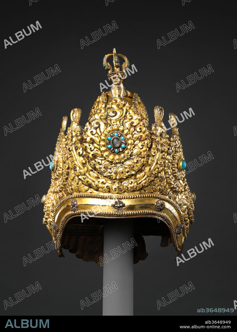 Vajracharya Priest's Crown. Culture: Nepal. Dimensions: H. 12 in. (30.5 cm); W. 7 1/2 in. (19.1 cm); D. 6 3/4 in. (17.1 cm). Date: dated 1717.
Elaborate crowns such as this example were worn by the hereditary Vajracarya Buddhist priests of Nepal, who occupy the highest rank in the Nepalese Buddhist community. Vajracarya is both a caste and a family name, and the designation entitles it holders to perform reserved priestly functions, analogous to the privileges held by Brahmans in Hinduism. This crown is dominated by five diadem plaques and surmounted by a half-vajra. The dated inscription records that it was commissioned by two named devotees, to be worn on the occasion of the consecration of newly installed icons of Chakrasamvara and Heruka. The consecrations were performed by sri Bekhasi deva Vajracarya of Naka Bahica of OBaha, "on Thursday, the 10th of the dark half of Bhadra, during the Pusya naksatra and the Siddha yoga" (1717). The inscription concludes by listing the punishments incurred by those who covet the crown as well as the merits earned by its donors, extolling: "[May it be] auspicious for all time.".