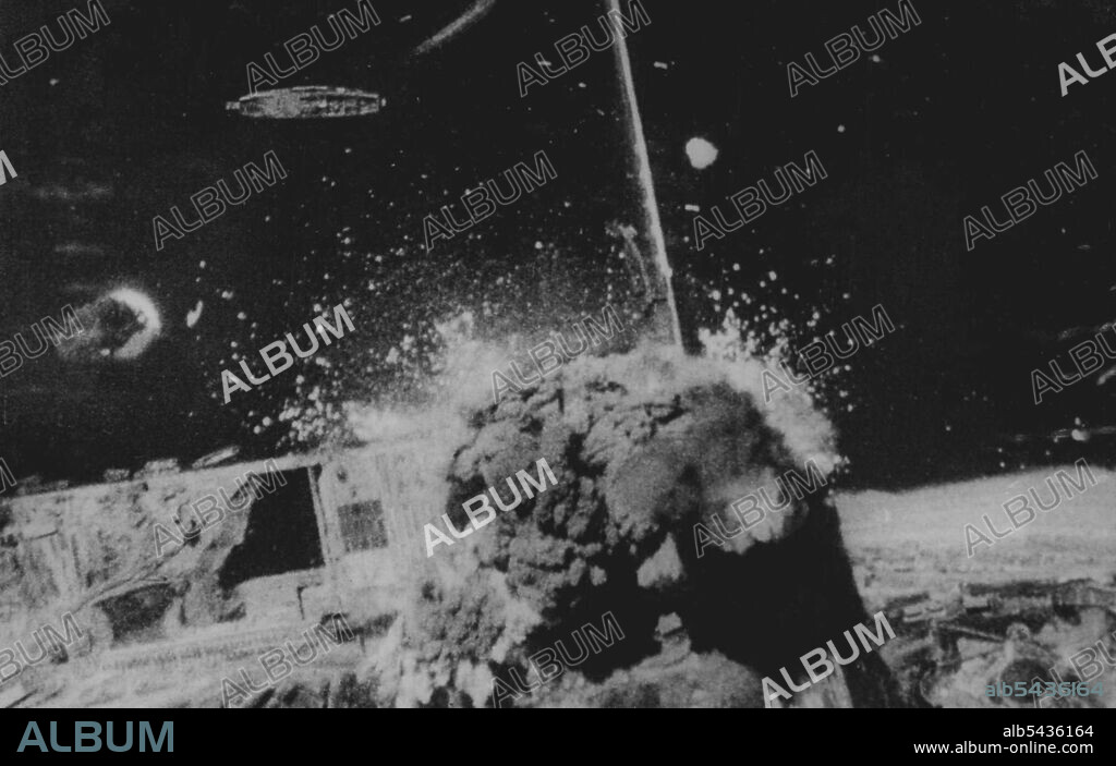 R.A.F. Bomber Command Attacks U-Boat Pens At Brest In daylight on August 5, aircraft of R.A.F. Bomber Command attacked the U-boat pens at Brest. Out of the sixteen aircraft taking part in the operation, five of them obtained direct hits with 12,000 pound bombs. It is estimated that the near misses obtained by the remaining aircraft would have set up a tidal wave thus undermining the structure of the U-boat pens. This photograph was taken from an aircraft of R.A.F. Bomber Command during the attac.