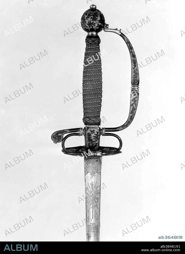 Smallsword Hilt and Blade. Culture: hilt, Japanese, possibly Dejima; blade, European. Dimensions: Hilt (a); L. approx. 7 in. (17.8 cm); W. approx. 4 in. (10.2 cm); Wt. 5.3 oz. (150.3 g); blade (b); L. 40 1/8 in. (101.9 cm); Wt. 5.5 oz. (155.9 g). Date: ca. 1730.
Sword hilts of European fashion made of shakudo, an alloy of copper and gold patinated to the blue-black color that was used in Japan for small decorative objects such as sword mountings, were probably fabricated for the Dutch East India Company at their trading post on the Japanese island of Deshima. Hilt elements like these were then exported to Holland, where they were fitted with grips and blades.