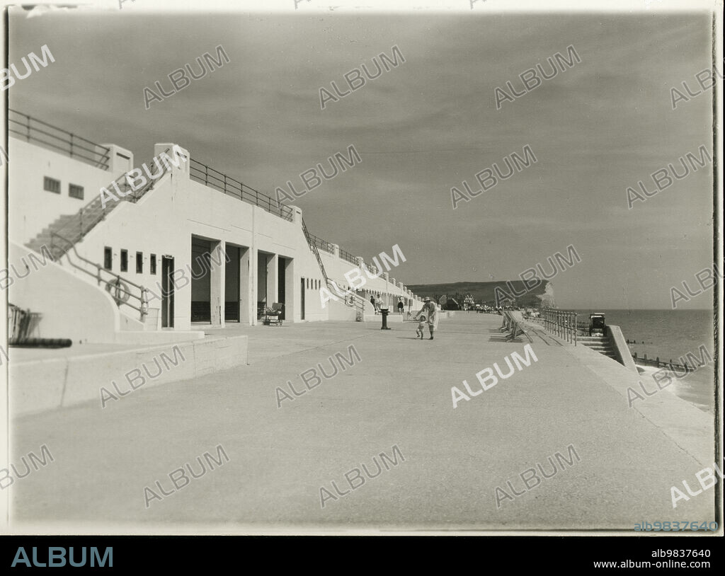 JOHN HENRY BALL. Seaford Promenade, Seaford, Lewes, East Sussex, 1933-1940. A view along Seaford promenade, with Seaford head visible in the distance.