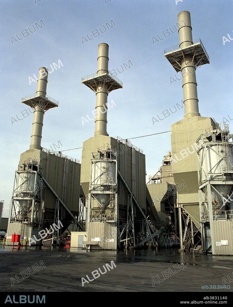 A close-up view of the power plant at the Wheelabrator Shasta Energy Company, Anderson, California - a 50 megawatt power plant. The Wheelabrator Shasta Energy Company uses three burner / boilers and steam turbines to convert residues from lumber waste and pulp paper (biomass) and agricultural residue into electricity. Use of biomass contributes to the local economy by creating jobs, ensuring domestic energy supplies, and providing an efficient and cost-effective source of energy. Biomass is biological material derived from living, or recently living organisms. It most often refers to plants or plant-based materials which are specifically called lignocellulosic biomass. As an energy source, biomass can either be used directly via combustion to produce heat, or indirectly after converting it to various forms of biofuel. Conversion of biomass to biofuel can be achieved by different methods which are broadly classified into: thermal, chemical, and biochemical methods.
