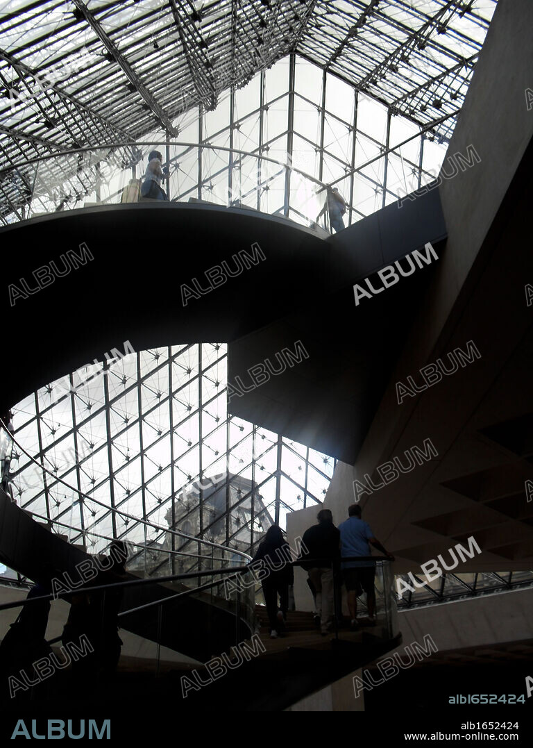 Interior of the 'Louvre Pyramid' at the Louvre museum, Paris France. Designed by I. M. Pei.