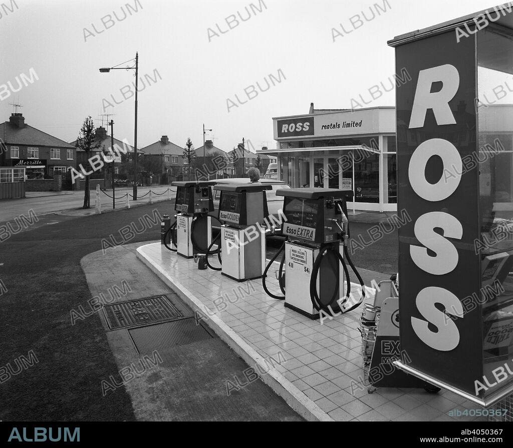 A petrol station forecourt, Grimsby, Lincolnshire, 1965. The Ross service station in Grimsby, from which they ran a car rental agency. The petrol on sale is from the Esso company and an Austin 1800 can be seen being filled up behind the pumps. Unkindly nicknamed the 'Land Crab', the 1800 was intoduced in 1964 with a total of 387,283 cars being produced over a ten year period.