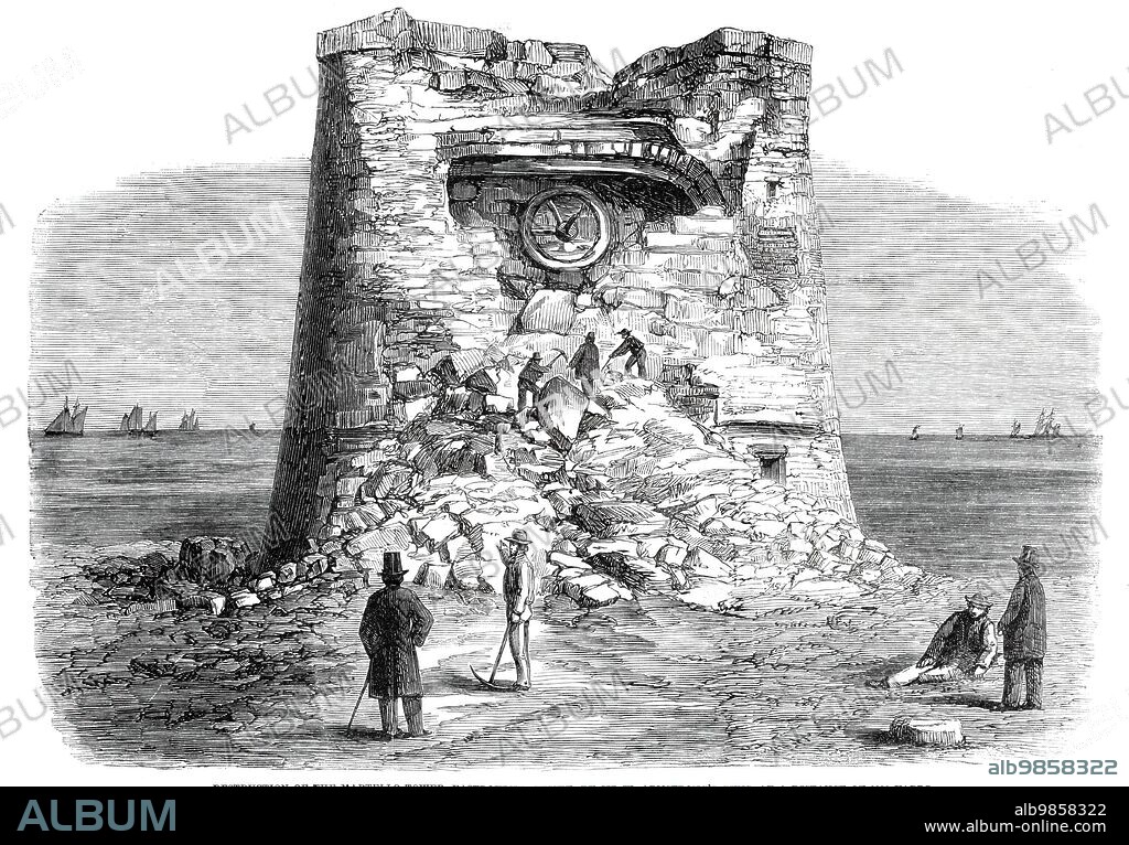 Destruction of the Martello Tower, Eastbourne, Sussex, by Sir W. Armstrong's guns, at a distance of 1032 yards, 1860. 'The guns employed were a 40-pounder of 31 cwt., an 80-pounder of 63 cwt., and a short 100-pounder, weighing only 53 cwt...the projectiles employed were partly solid shot and partly percussion-shells. The tower was built of very strong brickwork, the thickness of the walls being 7 ft. 3 in. on the land side, and 9 ft. on the side next the sea...The 80-pounder shot was found to pass quite through the wall into the Tower, piercing 7 ft. 3 in. of brickwork; the others lodged in the wall at the depth of about 5 ft. Live shells were then fired...with so much effect that, after eight or ten rounds from each gun, the interior of the tower became exposed to view...Nothing could exceed the precision with which these shells were thrown. The broken section of the wail was itself but a small object to hit, but this was done with such unerring certainty that the very spot selected was almost invariably struck. The total number of shot and shell fired against the tower was 170, of which only a small proportion was from the 100-pounder. The 100-pounder gun used on this occasion throws shell which weigh 1001b. and contain 81b. of powder...'. From "Illustrated London News", 1860.