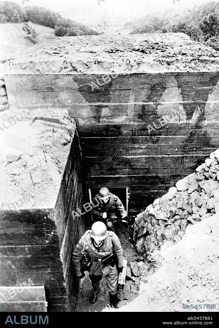 First Pictures Of Germany's Siegfried Line -- Members of a machine gun corps leaving their underground emplacement.These are the first pictures of Germany's new Siegfried line fortifications along that Western frontiers, described as "The most modern ad astounding works of our time". October 25, 1938. (Photo by Keystone).