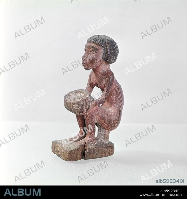 An emaciated man holding a bowl. Country of Origin: Egypt. Culture: Ancient Egyptian. Date / Period: 11-12th dynasties c. 2133 - 1786 BC. Material Size: wood.