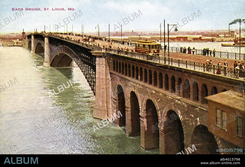 Eads Bridge, St Louis, Missouri, USA, 1910. Vintage postcard showing streetcars and pedestrians on the bridge. The city is visible in the distance. Designed by James B Eads, the bridge crosses the Mississippi between St Louis and East St Louis, Illinois. When completed in 1874, it was the longest arch bridge in the world.