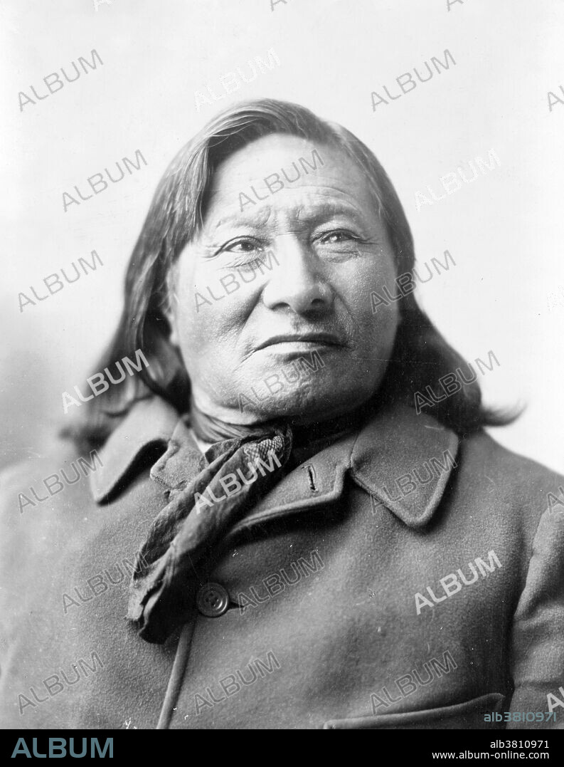 Rain-in-the-Face by Frank Bennett Fiske, circa 1900s. Rain-in-the-Face (1835 - September 15, 1905) was a war chief of the Lakota tribe. His name may have been a result of a fight when he was a boy in which his face was splattered like rain with his Cheyenne adversary's blood. He first fought against the whites in the summer of 1866 when he participated in a raid against Fort Totten (North Dakota). In 1868, he fought the US Army in the Fetterman massacre near Fort Phil Kearny (Wyoming). In 1873, he took part in the Battle of Honsinger Bluff where he ambushed and killed an army veterinarian John Honsinger. In 1874, he was arrested by Captain Thomas Custer for this murder, was taken to Fort Abraham Lincoln and incarcerated, but he escaped. In the spring of 1876, he joined Sitting Bull's band and traveled with him to the Little Big Horn River, and was among the Indian leaders who defeated Custer. He fled north into Canada, spending the next several years in exile. He finally led his band in to surrender in 1880 and was transferred to the Standing Rock Agency. On his deathbed, in 1905, he reputedly confessed to a missionary that he thought that he might have killed Custer, shooting him from so close as to leave powder marks upon his face.